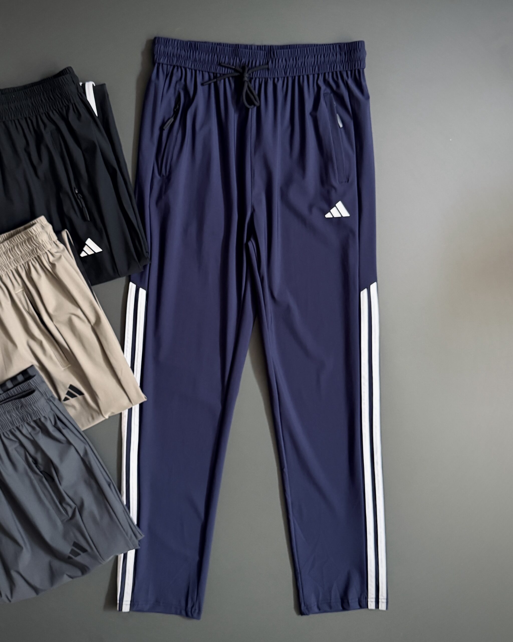 اسلش مردانه آدیداس Climacool | پارچه تنفس‌پذیر، کشی و جیب زیپ‌دار