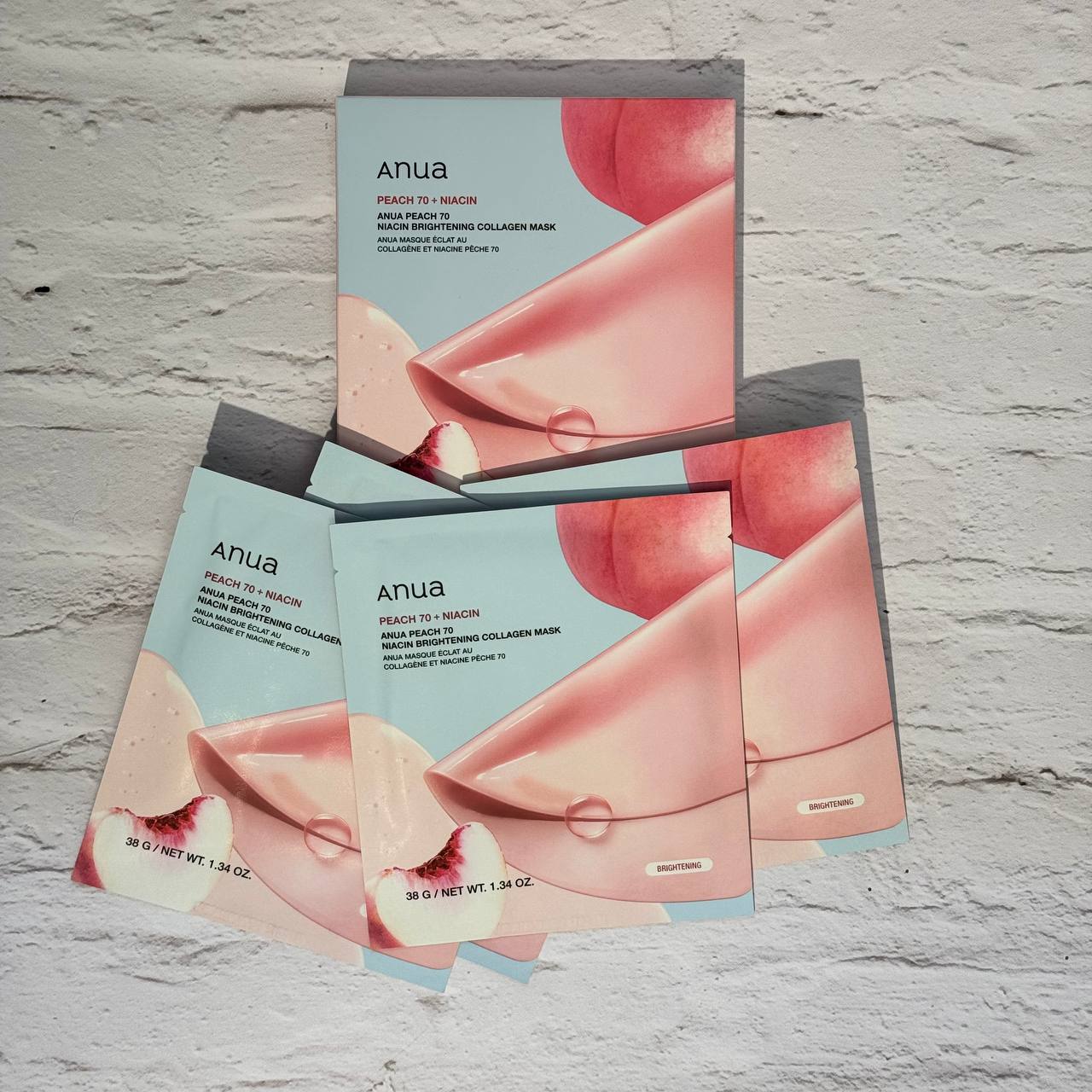 ماسک ورقه‌ای کلاژن هلو و نیاسینامید آنوا 1 ورق باز شده از پک Anua Peach 70 + Niacin Brightening Collagen Mask
