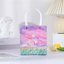 ساک کادویی دسته کنفی طرح دخترانه بنفش 24*21