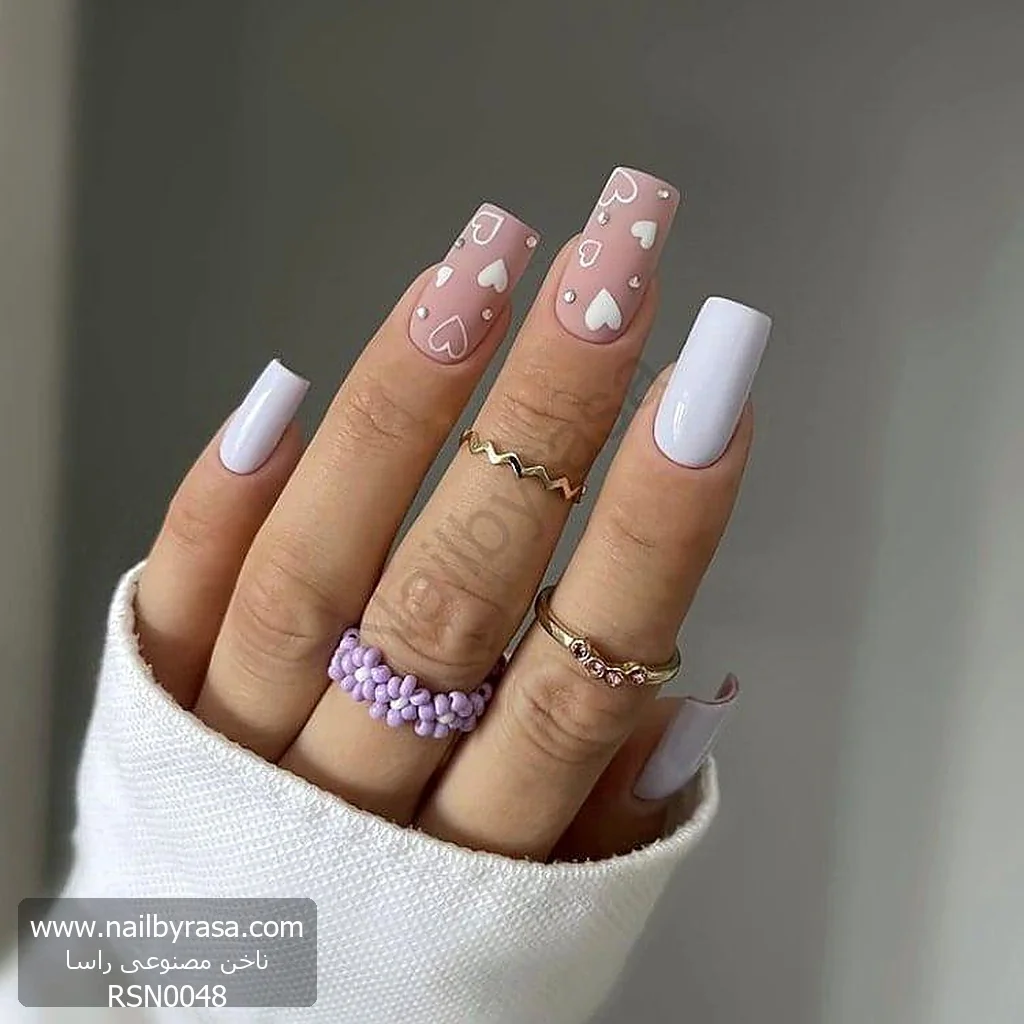 ناخن مصنوعی صورتی مات با طرح قلب سفید و نگین‌دار مربعی بلند راسا - RSN0048